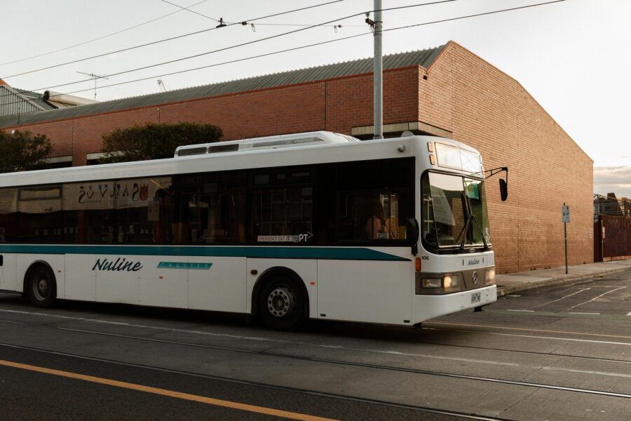 A bus travelling down a Melbourne street